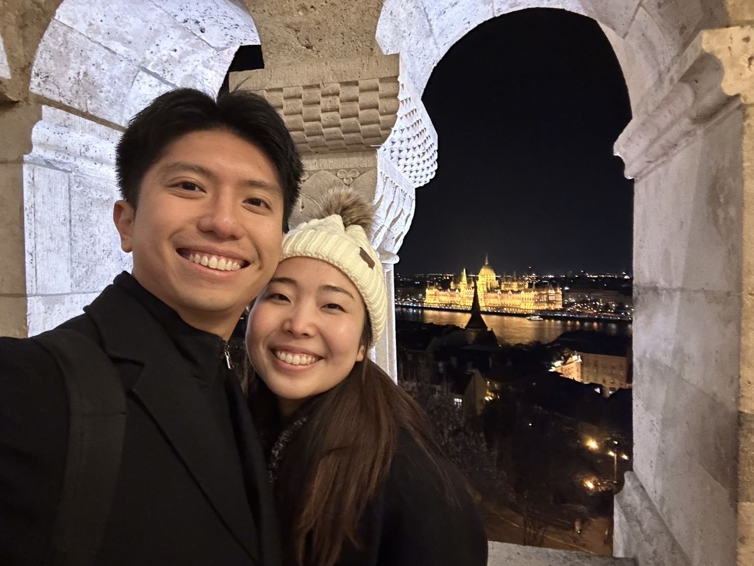Shawn and Hitomi smiling at night in Budapest
