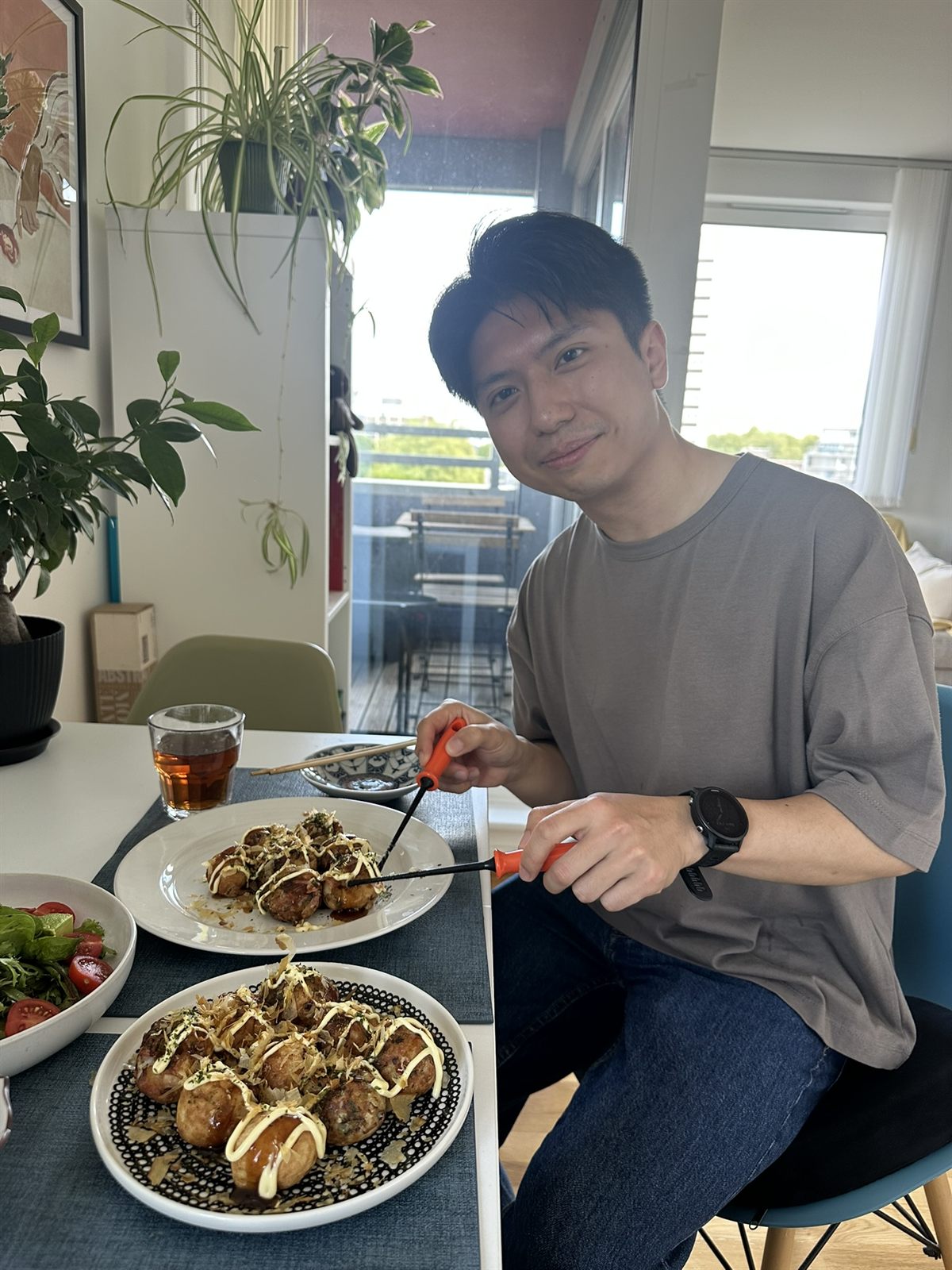 Shawn with a plate of homemade takoyaki